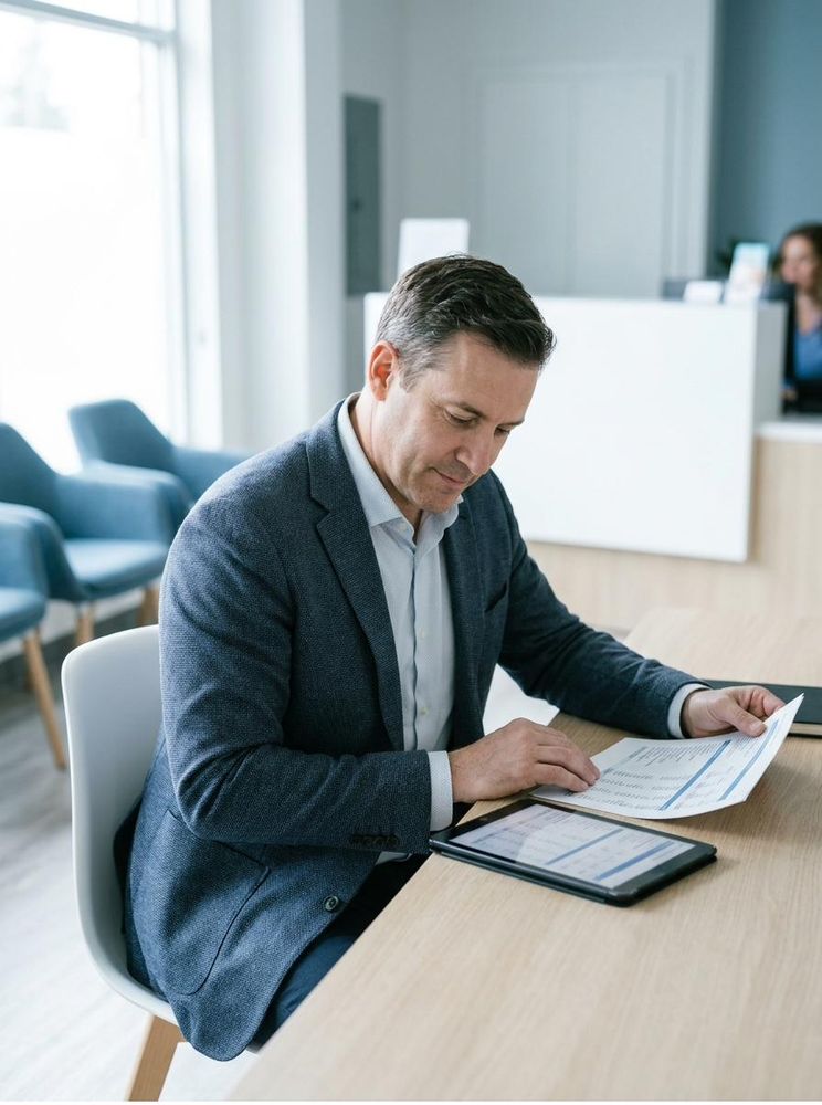 Healthcare practice owner reviewing financial reports